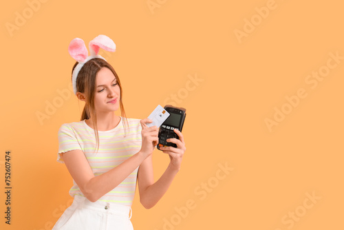 Young woman in bunny ears w...