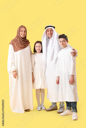 Happy Muslim family on yell...