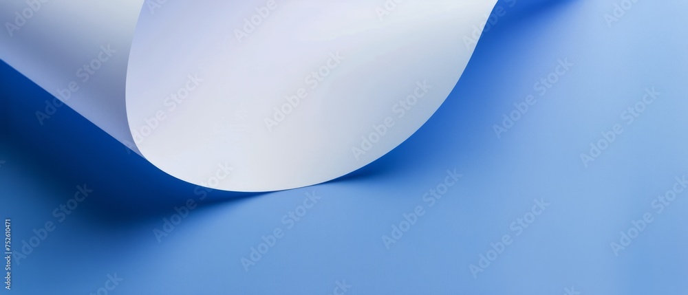 Roll of White Paper on Blue Surface Roll of White Paper on Blue Surface