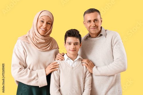 Happy Muslim family on yell...