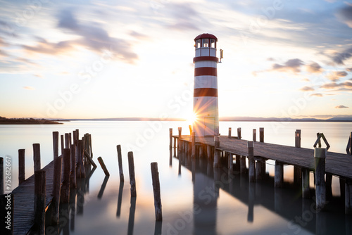 lighthouse on the pier during the sunset