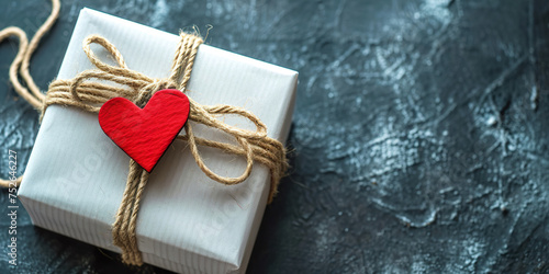 White Gift box and rope knot with heart-shaped, bix photo