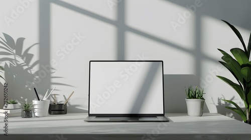 Modern personal computer with blank white screen, keyboard, mobile phone and office accessories on desk at workplace of graphic designer, blogger. Electronic devices, technology and creativity © irawan
