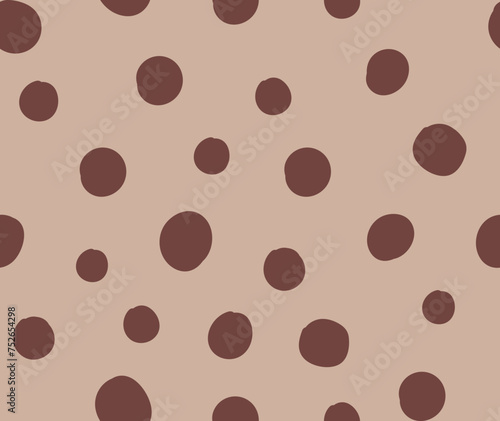All over seamless repeat pattern with tossed brown polka dot on soft latte ground. Versatile trendy modern background with tossed dots