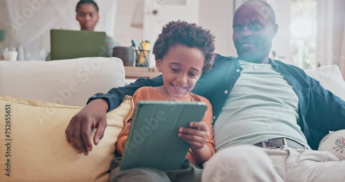 Dad, kid and learning with tablet on sofa for homeschool or online assessment and virtual education for courses. Parent, child and couch with touchscreen for digital literacy and growth development. photo
