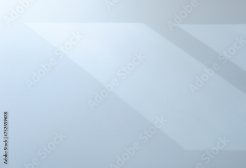 Minimalist abstract background of sunlight and shadow on white wall through the window