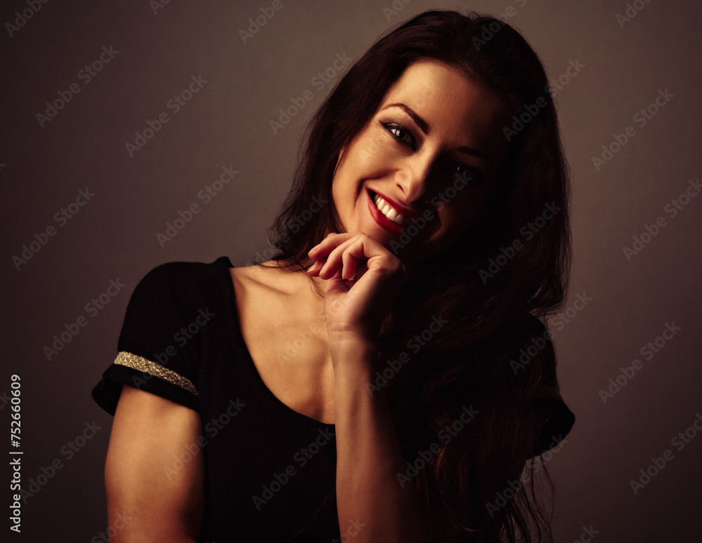 Beautiful makeup smiling woman with long hair in fashion dress looking on studio background. Closeup portrait Beautiful makeup smiling woman with long hair in fashion dress looking on studio background. Closeup portrait