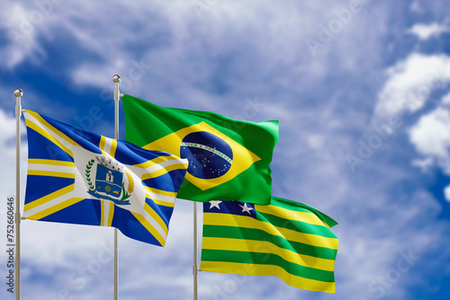 Official flags of the country Brazil, state of Goias and city of Anapolis. Swaying in the wind under the blue sky. 3d rendering photo
