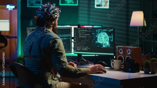 IT expert using EEG headset and machine learning to upload brain into computer, gaining immortality. Computer scientist develops AI experiment, inserting his persona into cyberspace, camera A photo