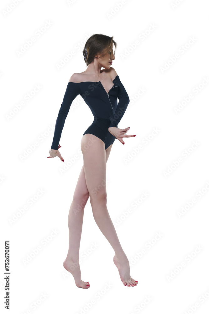 skinny ballerina in a black bodysuit poses in a photo studio showing dance moves
