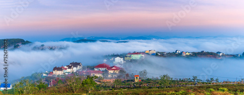 The morning landscape in the valley Da Lat, Vietnam with fog covered and sunrise background is so blurry, so beautiful and peaceful