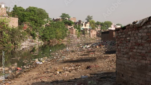 River Flowing Through Slum In India