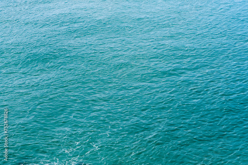 Blue sea water background. Top view of the surface of the sea.