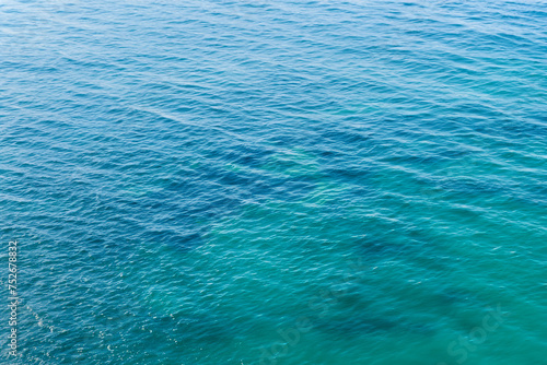 Blue sea water surface texture background. Top view of the sea.
