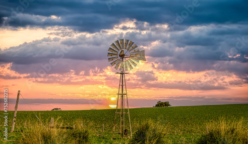 Beautiful old windmill at sunset on Farmland , Western Australia 