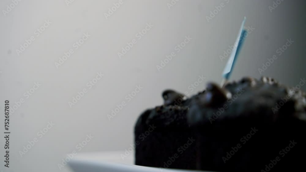 Valentine's day chocolate muffins rotating on a platter with a blue treat sign on top Valentine's day chocolate muffins rotating on a platter with a blue treat sign on top