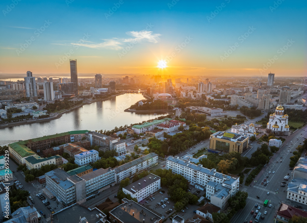 Yekaterinburg city and pond aerial panoramic view at summer sunset. View from Vysotsky skyscraper