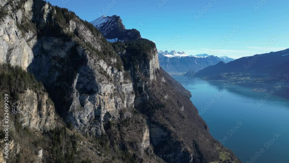Amden Weesen Switzerland flight towards cliffs over colourful and famous lake Amden Weesen Switzerland flight towards cliffs over colourful and famous lake