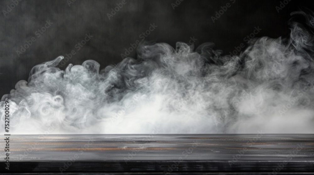 Mysterious white smoke spreading across a dark wooden background.