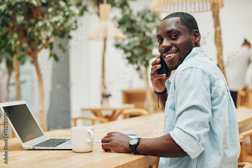 Happy man business phone technology male communication smartphone sitting person lifestyle talking young smile