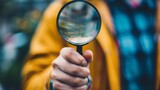 A person holding a magnifying glass symbolizing the need to carefully review and manage the details of a will and estate to avoid potential legal complications.
