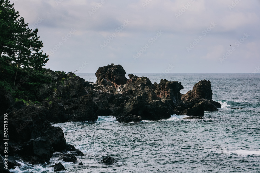 Jusangjeolli Cliff Columnar Joints and sea in Jeju Island, Korea. Jusangjeolli Cliff Columnar Joints and sea in Jeju Island, Korea.