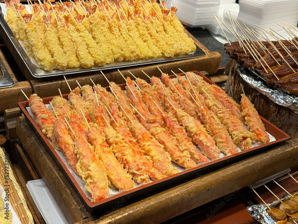 Fried shrimp on display at street food market.