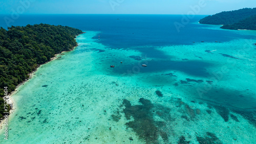 Fototapeta Naklejka Na Ścianę i Meble -  The aerial view with tropical seashore island in turquoise sea Amazing nature landscape