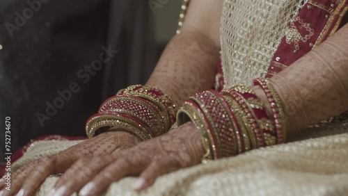 Gorgeous Bridal Accessories With Metal Bracelets Called Kadas. Close up Shot photo