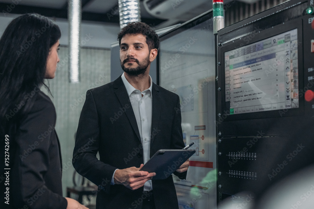 Fototapeta premium Robotic supervisor discuss with technical specialist from various department on strategic planning