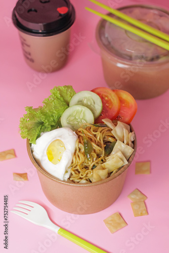 Spicy Fried Noodles With Egg And Vegetables And Blurred Background