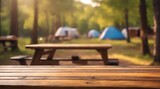 wooden table on blurred camping background