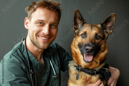 A man is smiling and holding a dog