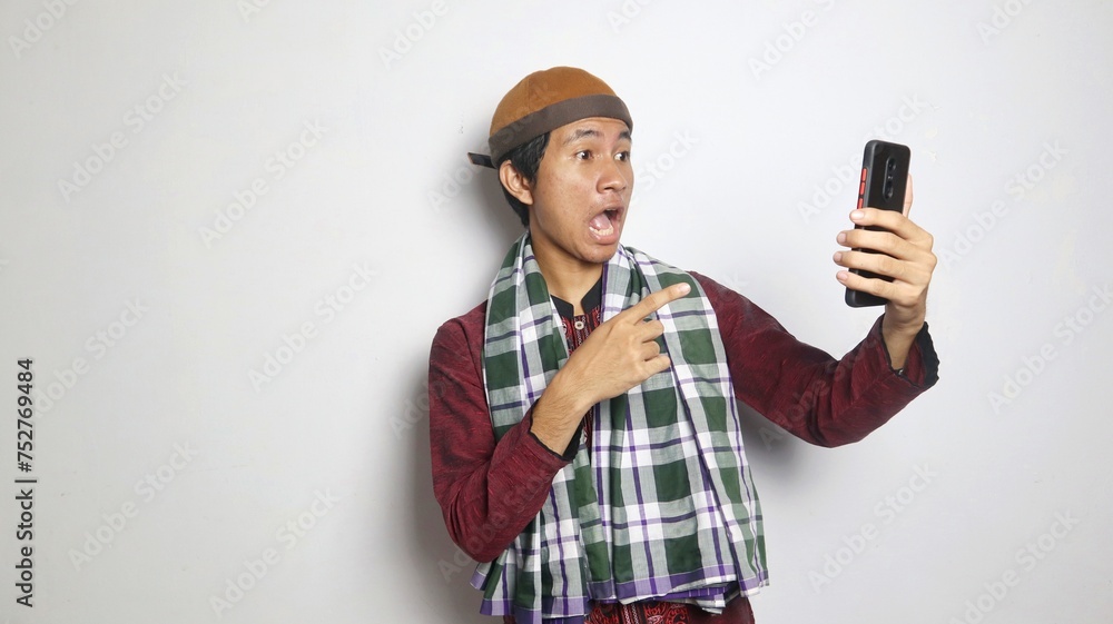 shocked Asian Muslim man selfie, video call on smartphone shocked Asian Muslim man selfie, video call on smartphone