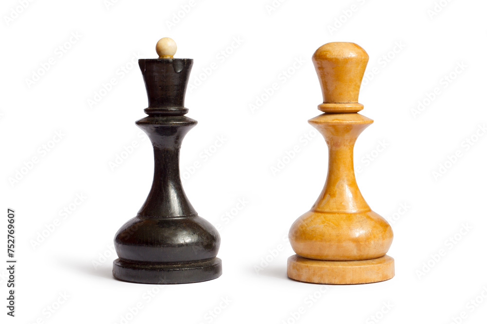 Black and white chess pieces on a white background. Old wooden chess pieces.
