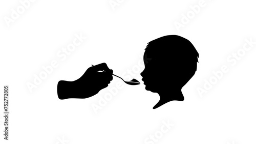 baby eats from a spoon, black isolated silhouette