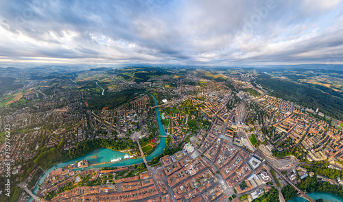 Bern, Switzerland. Panorama of the city in cloudy weather. Sun rays. Summer morning. Aerial view