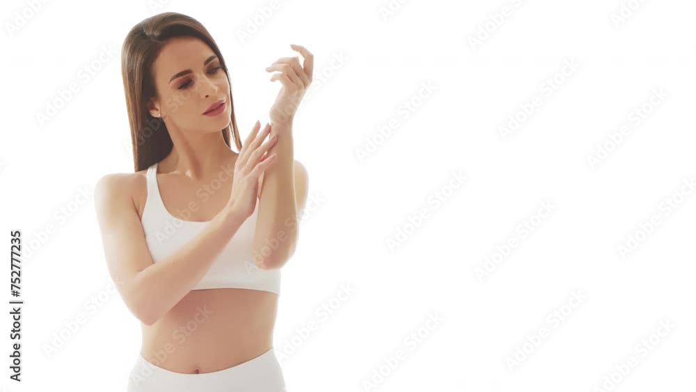 Beautiful woman in white underwear over isolated white background. Close-up studio video of healthy young girl in swimsuit. Health and skin care, wellness, dieting and cosmetics concept. Beautiful woman in white underwear over isolated white background. Close-up studio video of healthy young girl in swimsuit. Health and skin care, wellness, dieting and cosmetics concept.