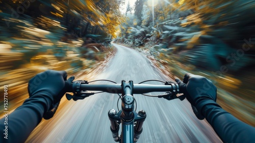 First-person perspective of mountain biking on a forest trail in fall