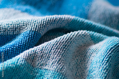 Konstfotografi Crumpled surface of a white and blue cotton towel with pleats