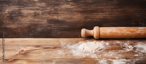 Crafting Homemade Delights: Rolling Out Fresh Dough on Rustic Wooden Table photo