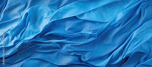Elegant Blue Silk Fabric with Delicate Folds - Luxurious Textile Background