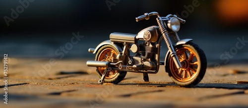 Vibrant Toy Motorcycle Resting on the Ground, Ready for a Playful Adventure photo