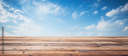 Serene Wooden Floor Beneath a Clear Blue Sky Background - Tranquil and Relaxing Scene