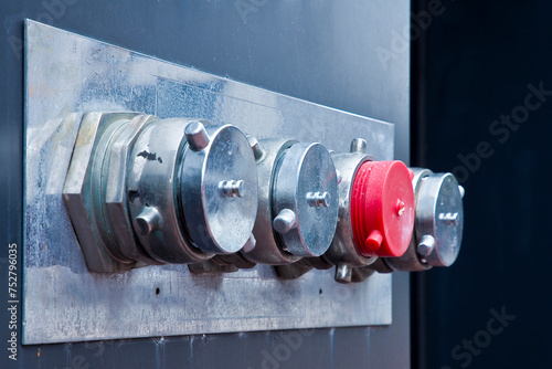 Auto sprinkler standpipe connector - Fire department connection outside of a building - Fire department connections for sprinkler systems and pump on the exterior wall in San Francisco