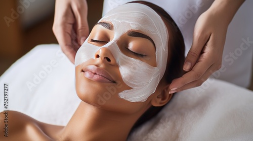 Serene Woman Receiving Luxurious Facial Mask Treatment at Spa with a Professional Touch
