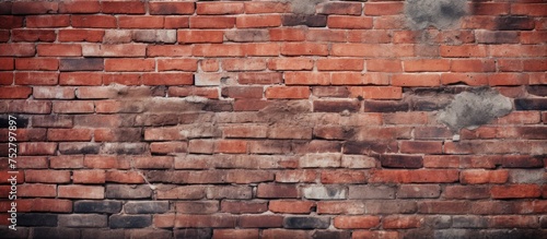 A weathered red brick wall is prominently featured against a gritty, textured background. The bricks show signs of age and wear, adding character to the urban scene.