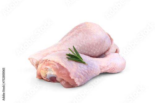 Raw chicken leg with rosemary isolated on white background.