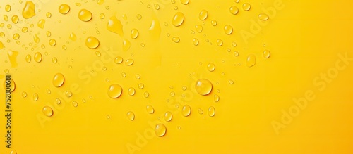Vibrant Yellow Background with Glistening Water Drops - Refreshing Summer Concept