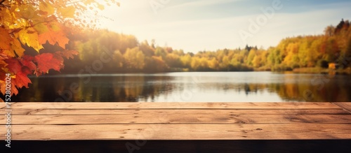 Tranquil Serenity: A Rustic Wooden Table Overlooking a Majestic Lake Landscape